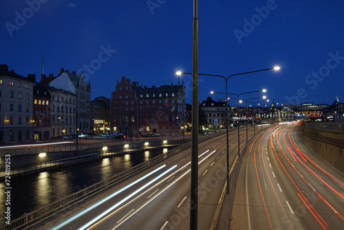 a view of a city street filled with traffic at night photo
