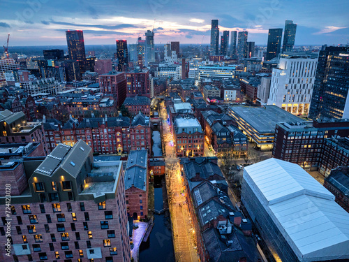 Aerial image of Manchester canal street and the city skyline with a sunset horizon 