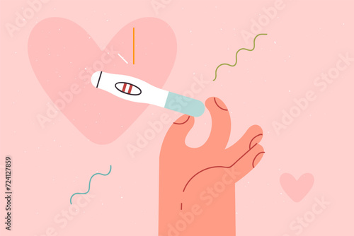 Pregnancy test with positive result in hands of woman, for concept importance of using contraception