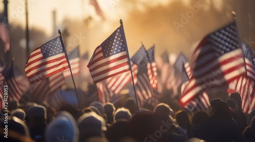 Background blur of crowd at political rally in the United States holding signs and carrying US flags. Great image for upcoming election cycle in 2024 presidential campaigns. Copy space