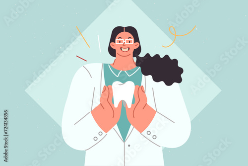 Woman dentist demonstrates large human tooth calling for attention to oral diseases