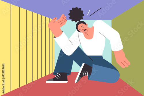 Woman suffering from claustrophobia sits in cramped box and feels pressure from walls, causing panic