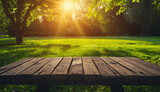wooden patio bench and green field in