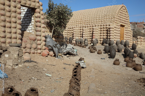 pottery, buildings, rubish in a village photo