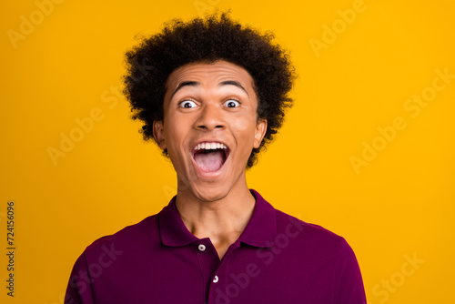 Photo of cheerful positive glad man open mouth wear magenta polo wow offer isolated on yellow color background