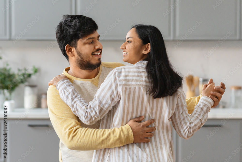 Portrait of beautiful indian couple dancing at kitchen Portrait of beautiful indian couple dancing at kitchen
