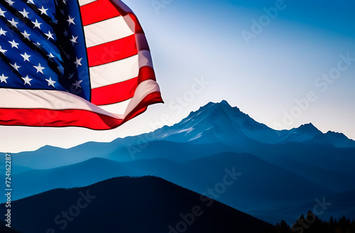 The American flag against the backdrop of a mountain range
