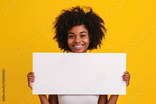 A woman holding a white sign in front of her face. Versatile image for various uses photo