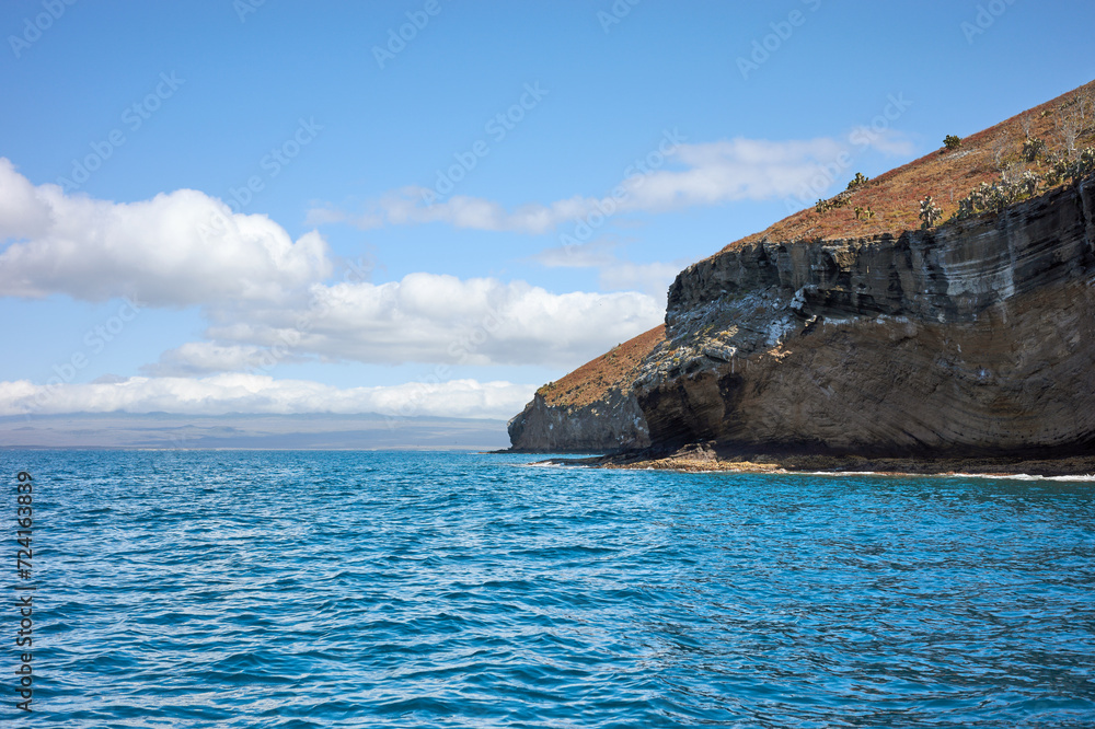 Cliff of an uninhabited island seen from the water, Galapagos National Park, Ecuador.