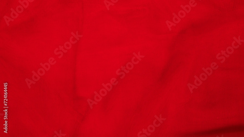 luxury red tulle fabric with wavy folds, texture, abstract background