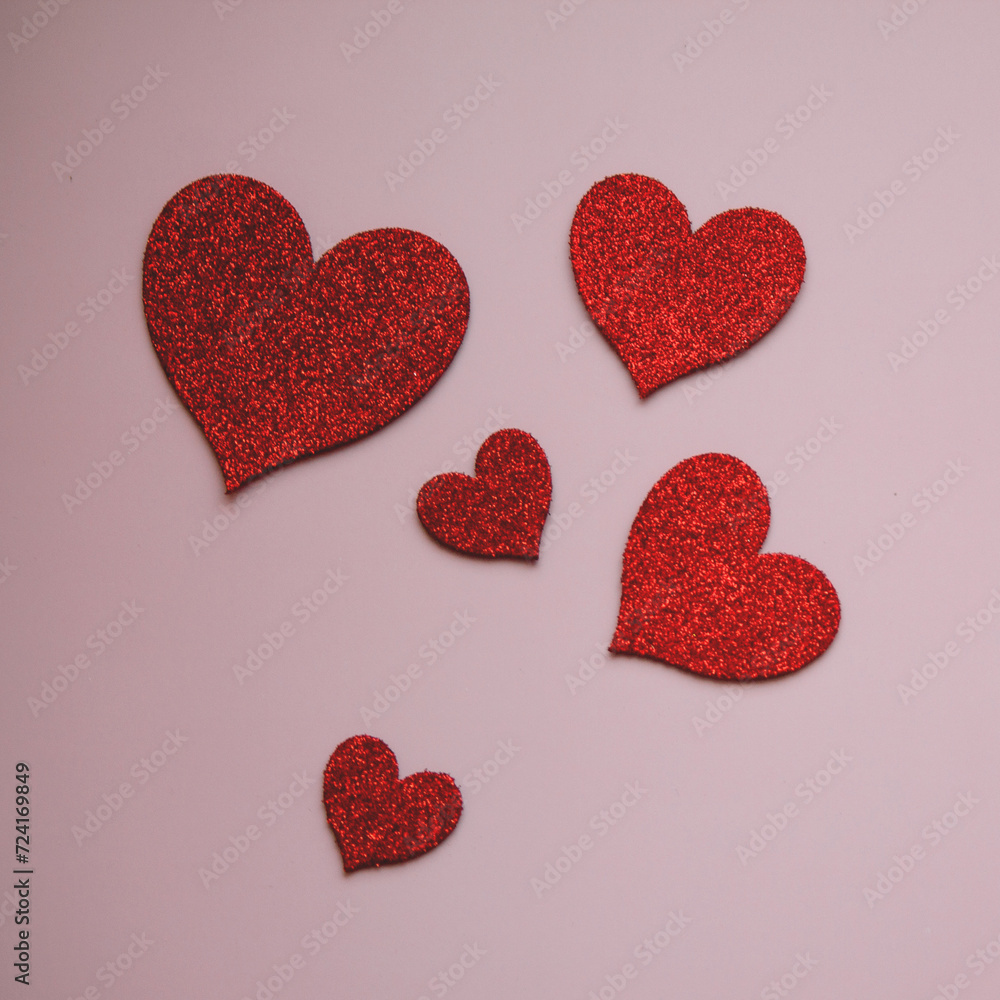 Hearts on a pink background, valentine or greeting card, symbol of love, flat lay, copy space Hearts on a pink background, valentine or greeting card, symbol of love, flat lay, copy space