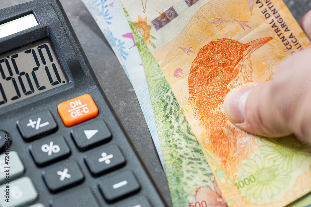 Argentine pesos, financial settlements in Argentina, taxes, Argentine currency exchange rate, financial analysis