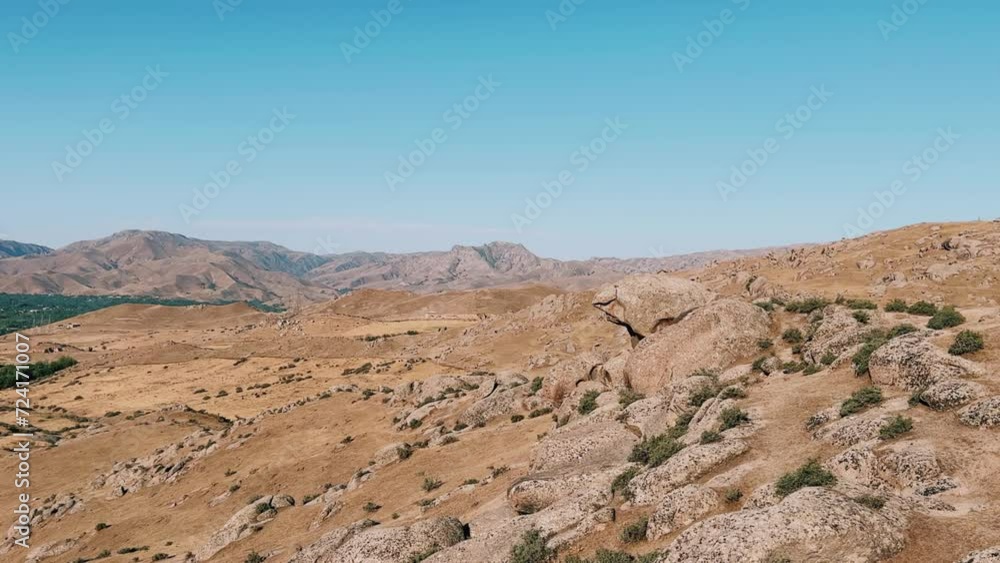 The Valley of Demons in Uzbekistan in the Samarkand region. Boulders, granite sculptures, huge boulders of bizarre shapes in the spurs of the Zaravshansky ridge. 4K Video The Valley of Demons in Uzbekistan in the Samarkand region. Boulders, granite sculptures, huge boulders of bizarre shapes in the spurs of the Zaravshansky ridge. 4K Video