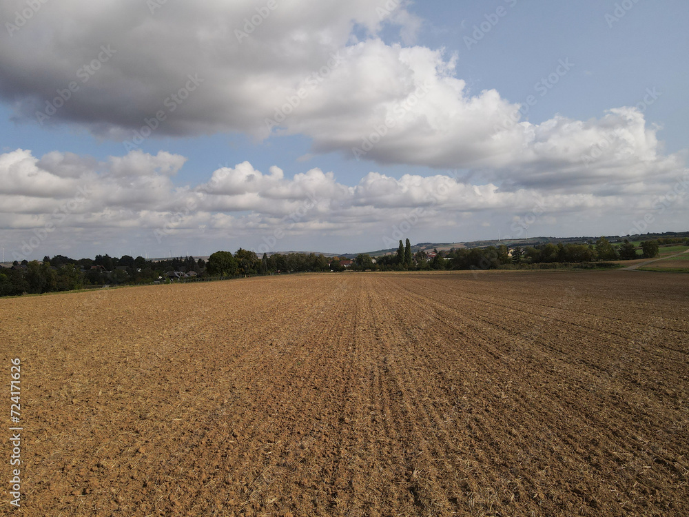 Farmland with brown soil in the countryside