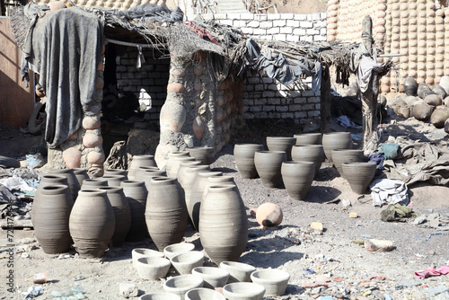 pottery, rubish, buildings in a village photo