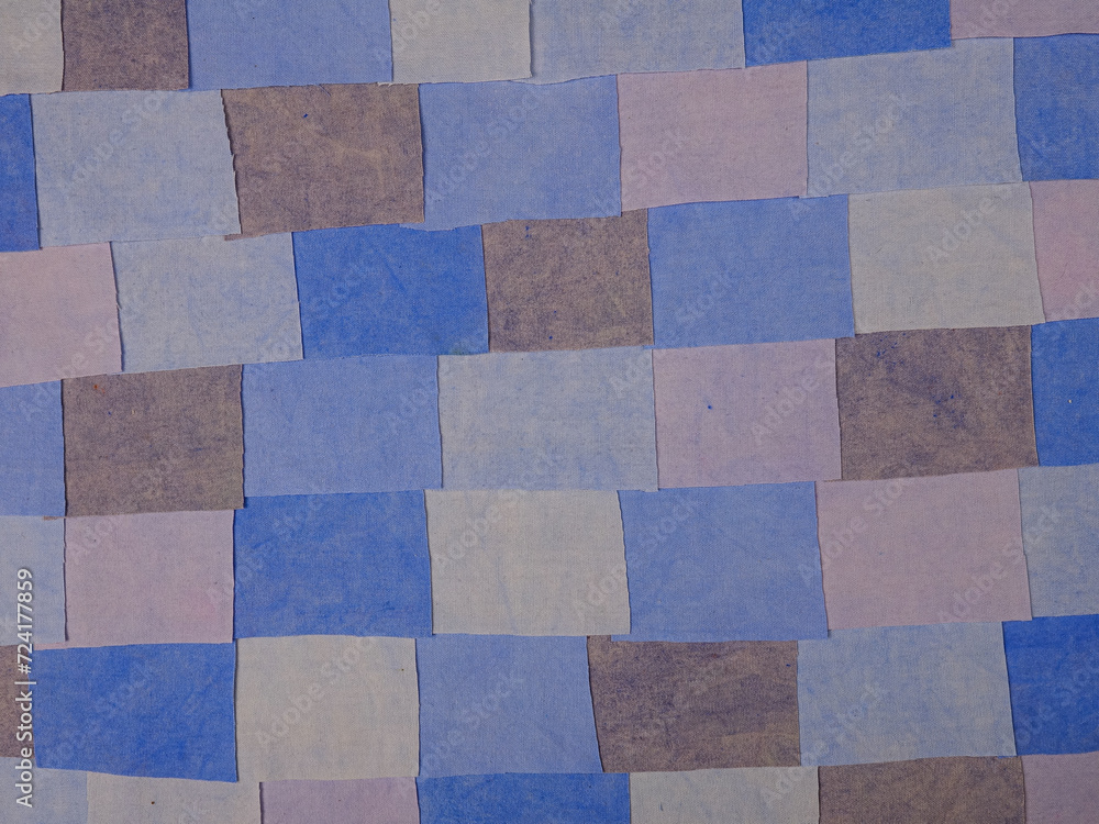 Fototapeta premium Handmade background in patchwork style with cotton fabric elements in blue tones