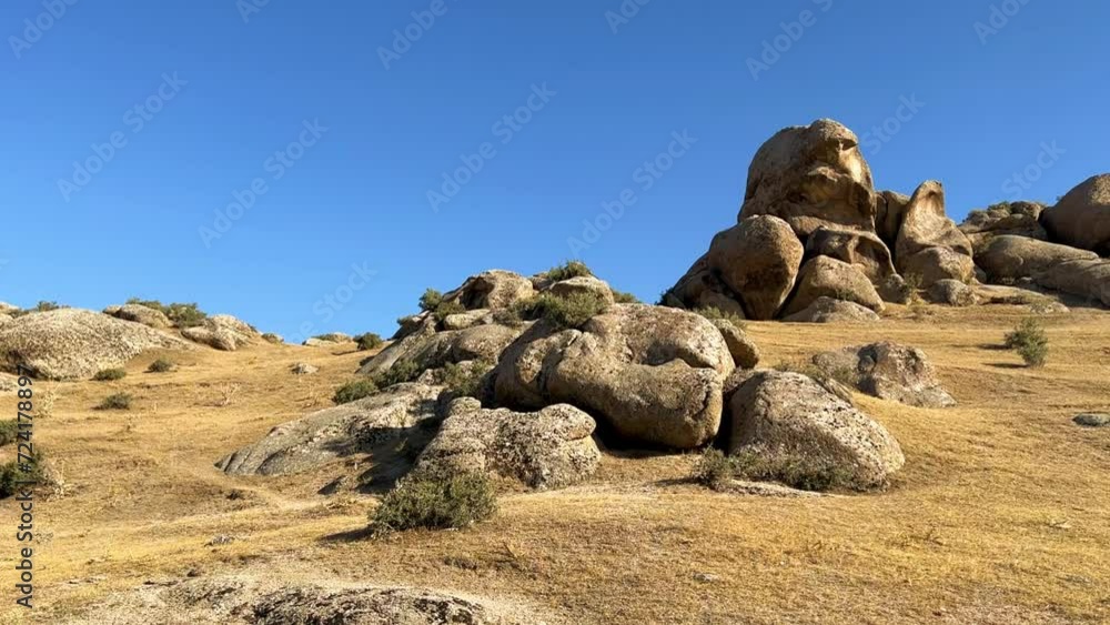 The Valley of Demons in Uzbekistan in the Samarkand region. Boulders, granite sculptures, huge boulders of bizarre shapes in the spurs of the Zaravshansky ridge. 4K Video The Valley of Demons in Uzbekistan in the Samarkand region. Boulders, granite sculptures, huge boulders of bizarre shapes in the spurs of the Zaravshansky ridge. 4K Video