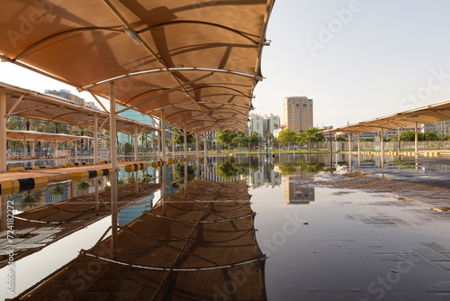 Parking at the Museum of Islamic Art in Qatar after a rainy day with a beautiful reflection photo