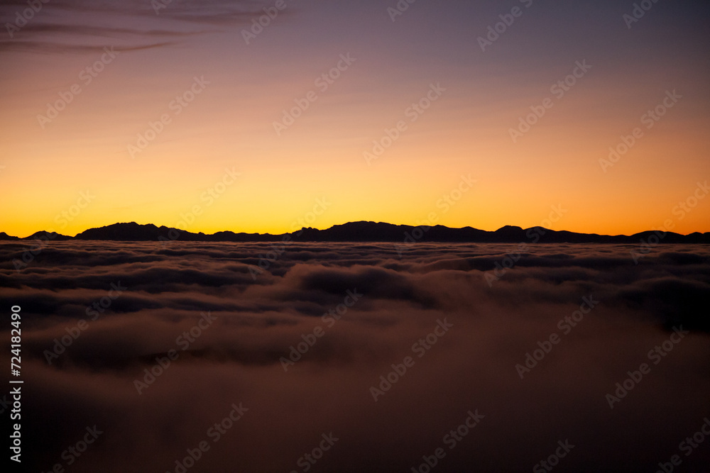 Spectacular sunset over a sea of clouds