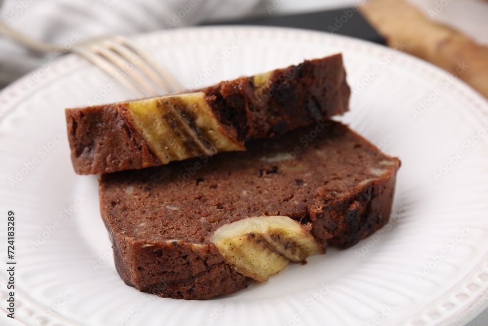 Slices of delicious banana bread served on table, closeup