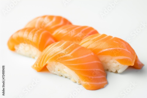 Simplicity of Sushi: Fresh Salmon Nigiri Slices on a Pristine White Background