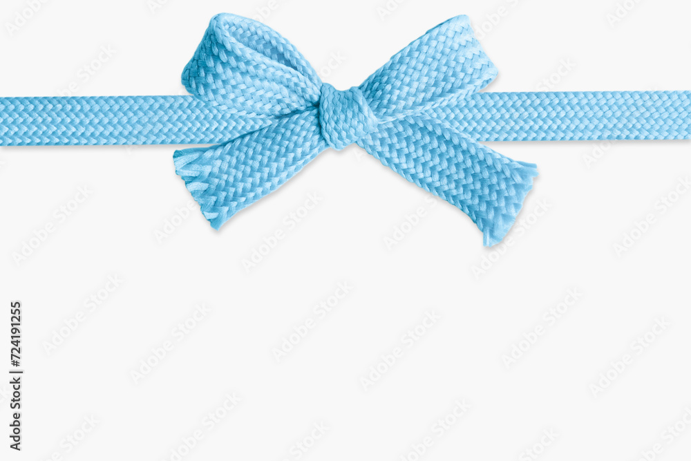 Blue bow made of thick knitted material on a light  background