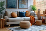 A cozy living room filled with comfortable seating options, including a plush couch and loveseat adorned with vibrant pillows and poufs, all set against a stylish backdrop of wicker accents and a bea