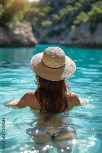 a picturesque scene of a young woman lounging in a pool