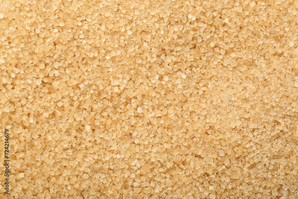 Granulated brown sugar as background, top view Granulated brown sugar as background, top view
