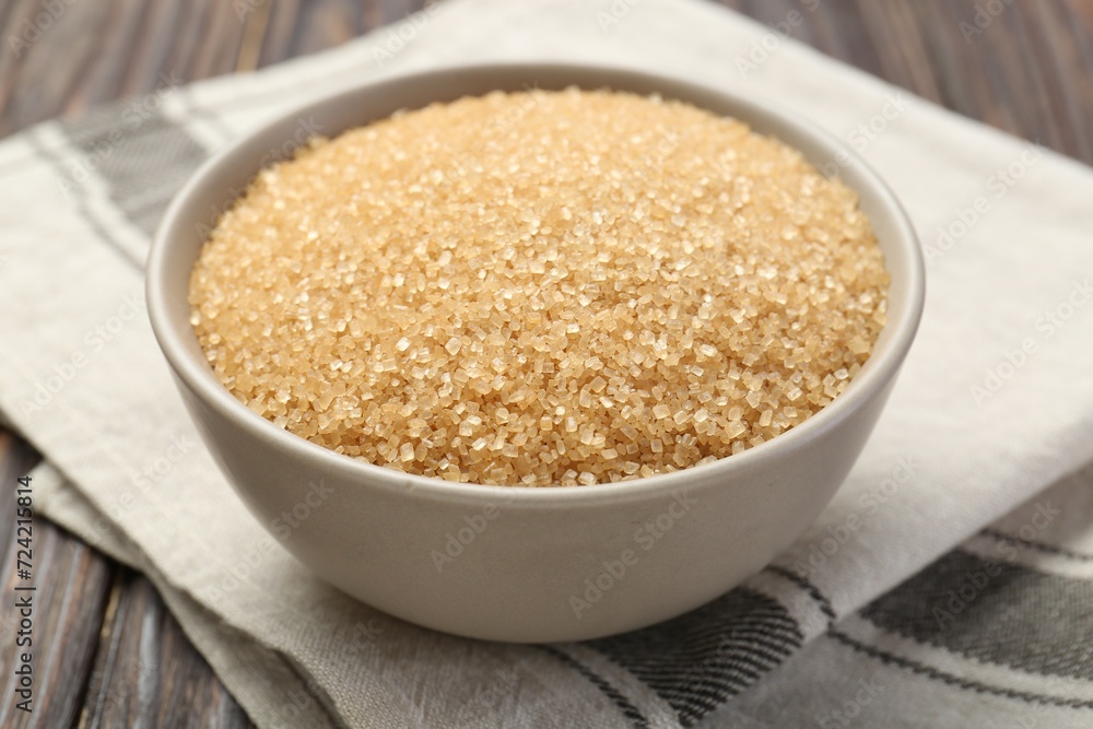 Brown sugar in bowl on table, closeup Brown sugar in bowl on table, closeup