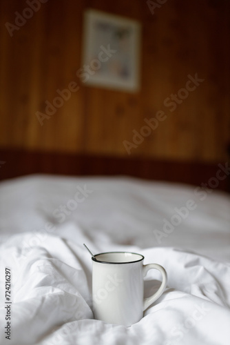 Morning Comfort: A Warm Cup on a Cozy Bed
