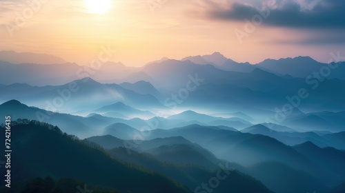 Beautiful rocky mountainous landscape at orange dawn with sun through the clouds