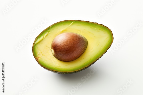 Avocado on white background. Half of fruit with seed. Close up. Green healthy vegetable. Environmentally friendly vegetarian organic product. Advertising, banner, food blogging, web design, menu