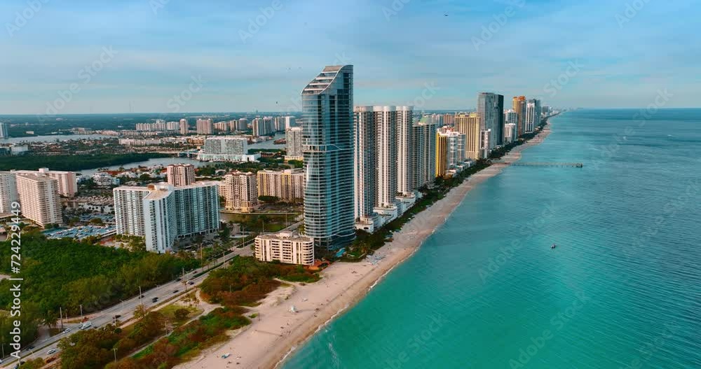 Stunning view of Miami Beach at sunset. Aerial perspective of the city from footage above the Atlantic Ocean. Stunning view of Miami Beach at sunset. Aerial perspective of the city from footage above the Atlantic Ocean.
