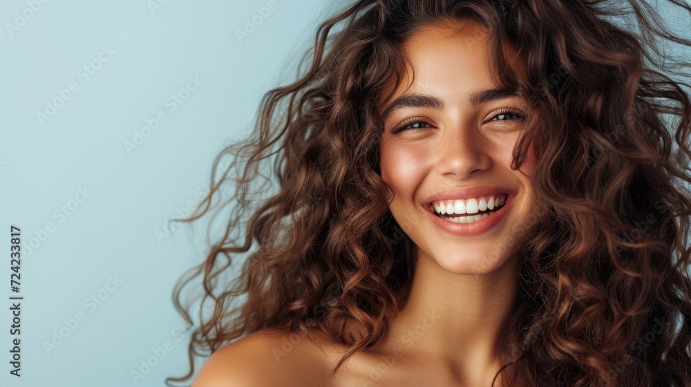 Beautiful laughing brunette model girl with long curly hair . Smiling woman hairstyle wavy curls . Fashion , beauty and makeup portrait Beautiful laughing brunette model girl with long curly hair . Smiling woman hairstyle wavy curls . Fashion , beauty and makeup portrait