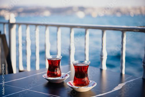 Canvas Print Turkish tea is served in a cafe with Bosphorus view in Istanbul, Turkey
