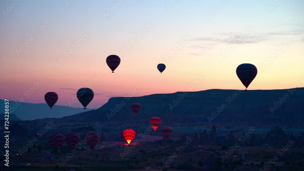 Turkiye, Cappadocia - 2th Sep 2023. Captured against the canvas of the Cappadocian sky, this video showcases the enchanting spectacle of a hot air balloon festival. The vibrant balloons rise gracefull Turkiye, Cappadocia - 2th Sep 2023. Captured against the canvas of the Cappadocian sky, this video showcases the enchanting spectacle of a hot air balloon festival. The vibrant balloons rise gracefull