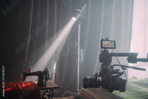 Professional cinema and video camera on the set. Shooting shift, lighting fixtures, shooting equipment and the team.