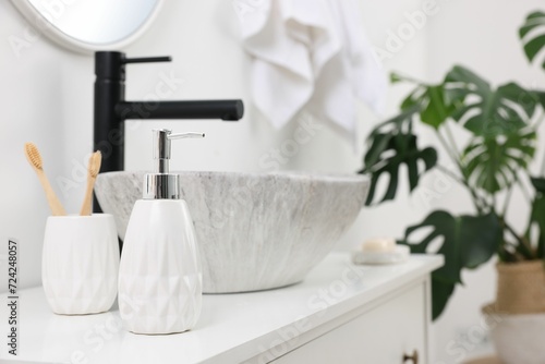 Different bath accessories and personal care products on bathroom vanity indoors, space for text
