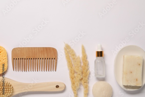 Bath accessories. Different personal care products and dry spikelets on white background  flat lay with space for text