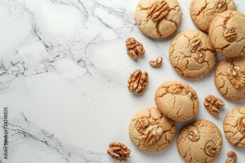 Text space available for walnut shaped homemade cookies with boiled condensed milk on a white marble table