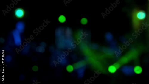 blurred Dynamic Live Performances, Rock Band with Guitarists and keyboardists, soloists perform on stage at night, Bright Colorful Strobing Lights on Stage, Live Music Performance, strobing lights photo