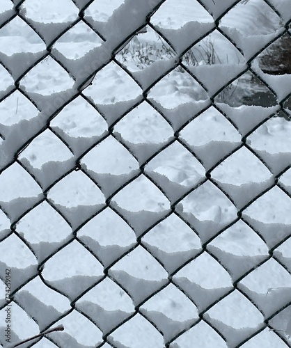 Snow pattern on chainlink fence