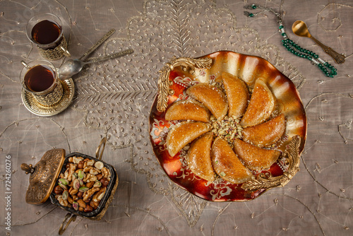 Stuffed Qatayef with nuts . A typical dessert of the the Arab world in the Holy month of Ramadan  © Israa