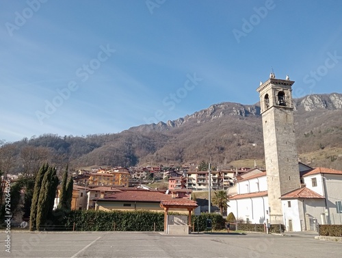 view of cathedral with mountains in Valle Trompia in Brescia, northern Italy photo