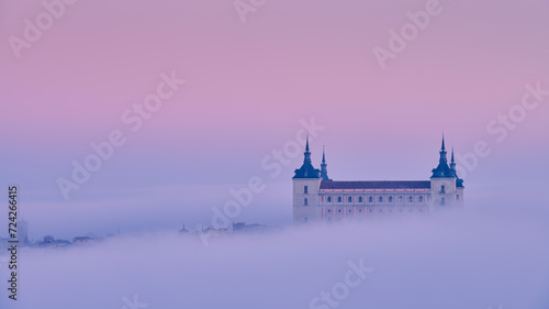 Foggy sunrise over an historical building