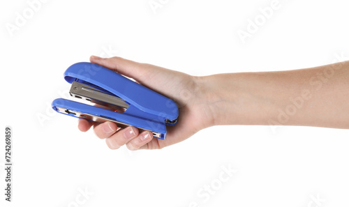 Woman holding blue stapler on white background, closeup