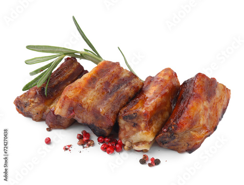 Tasty roasted pork ribs, rosemary and peppercorns isolated on white