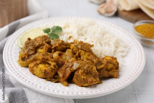 Delicious chicken curry with rice on table, closeup