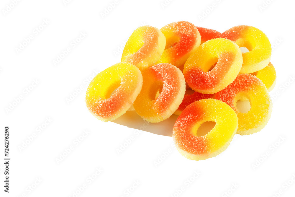 On a white isolated background, fruit colored jelly marmalade in the shape of rings. On a white isolated background, fruit colored jelly marmalade in the shape of rings.